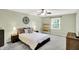 Bedroom with a queen bed, neutral walls, ceiling fan, and plenty of natural light at 9036 Buckeye Ct, Indianapolis, IN 46260