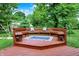 Beautiful deck in a lush backyard setting with great space to relax and gather at 9036 Buckeye Ct, Indianapolis, IN 46260