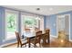 Sunlit dining room featuring a bay window overlooking the outdoor patio and backyard at 9036 Buckeye Ct, Indianapolis, IN 46260