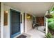 Inviting covered front porch with decorative hanging plants and charming details at 9036 Buckeye Ct, Indianapolis, IN 46260