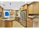 Spacious kitchen with stainless steel appliances, granite countertops, and ample wooden cabinetry at 9036 Buckeye Ct, Indianapolis, IN 46260