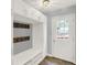 Mud room with white built-ins, hooks, and easy access to the outside at 9036 Buckeye Ct, Indianapolis, IN 46260
