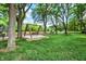 Community park featuring a wooden swing set, benches, picnic tables, and lush green lawn at 9036 Buckeye Ct, Indianapolis, IN 46260