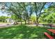 Picturesque park with playground, picnic tables and ample green space, ideal for families at 9036 Buckeye Ct, Indianapolis, IN 46260