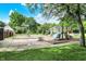 Community playground featuring slides, climbing structures, swings, and picnic tables at 9036 Buckeye Ct, Indianapolis, IN 46260