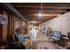 Large unfinished basement space with exposed ceiling, concrete floor, and furniture at 905 N Main St, Fortville, IN 46040