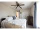 Cozy bedroom with ceiling fan and closet doors at 905 N Main St, Fortville, IN 46040