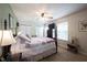 Comfortable bedroom with ceiling fan and large windows at 905 N Main St, Fortville, IN 46040