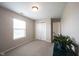 Bedroom featuring neutral walls, carpet, a window, closet, and white door at 905 N Main St, Fortville, IN 46040