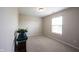 Bedroom featuring neutral walls, carpet, a window, and plant on a green covered table at 905 N Main St, Fortville, IN 46040