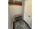 Functional entryway features a shelf, baskets, and patterned rug for a welcoming and organized space at 905 N Main St, Fortville, IN 46040