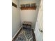 Cozy entryway nook with baskets and a wooden shelf for organizing coats and accessories at 905 N Main St, Fortville, IN 46040