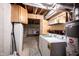 Basement laundry area with a washer, dryer, hot water tank, and storage at 905 N Main St, Fortville, IN 46040