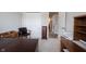 Bright home office featuring neutral walls, closet, desk, chair, and access to other rooms at 905 N Main St, Fortville, IN 46040