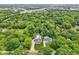 Stunning aerial view of property showcasing lush green surroundings and beautiful homes at 9155 Kerwood Dr, Indianapolis, IN 46240