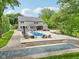 Gorgeous backyard with a pool, patio, and ample space for outdoor relaxation and entertaining at 9155 Kerwood Dr, Indianapolis, IN 46240