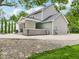 Outdoor backyard with outdoor seating, a swimming pool, a spa, and lush landscaping, perfect for entertaining at 9155 Kerwood Dr, Indianapolis, IN 46240