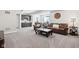 Open basement with a wet bar, living area, and comfortable seating at 9155 Kerwood Dr, Indianapolis, IN 46240