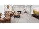 Spacious basement featuring a lounge area, a pool table, and stairs to another level at 9155 Kerwood Dr, Indianapolis, IN 46240