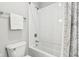 Clean white bathroom with a tiled shower-tub combination and sleek chrome fixtures at 9155 Kerwood Dr, Indianapolis, IN 46240