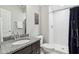 Bathroom showcasing a shower, granite countertop, and modern fixtures at 9155 Kerwood Dr, Indianapolis, IN 46240