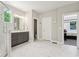 Modern bathroom with marble floors, shower, gray vanity, and bright natural light at 9155 Kerwood Dr, Indianapolis, IN 46240