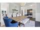 Spacious dining room with a large wooden table, comfortable seating, and an open layout at 9155 Kerwood Dr, Indianapolis, IN 46240