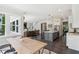 Open-concept kitchen boasts an island with a sink and views of the breakfast nook and living room at 9155 Kerwood Dr, Indianapolis, IN 46240
