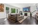 Cozy living room with large windows, fireplace, and comfortable seating area at 9155 Kerwood Dr, Indianapolis, IN 46240