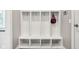 Organized mudroom with white storage cubbies, hooks, and lower shelving for shoes and accessories at 9155 Kerwood Dr, Indianapolis, IN 46240