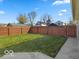 Spacious backyard featuring a well-maintained lawn and a privacy fence surrounding the property at 921 S State Ave, Indianapolis, IN 46203