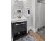 Updated bathroom featuring a modern vanity, a framed mirror, and a walk-in shower with new fixtures at 921 S State Ave, Indianapolis, IN 46203