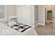 Comfortable bedroom features a soft carpet, a queen bed, and a large closet for storage at 921 S State Ave, Indianapolis, IN 46203