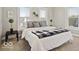 Cozy bedroom features natural light and a comfortable queen-sized bed with stylish black and white accents at 921 S State Ave, Indianapolis, IN 46203