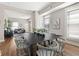 Open-concept layout showcases the dining area with a dark wood table and sightlines to the living room at 921 S State Ave, Indianapolis, IN 46203