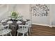 Inviting dining room with a dark wood table, seating for eight, and stylish decorations on the walls at 921 S State Ave, Indianapolis, IN 46203