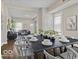 Open dining room area leads into the living room with a view of natural light and hardwood floors at 921 S State Ave, Indianapolis, IN 46203