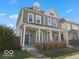 Charming two-story home featuring a welcoming front porch and classic architectural details at 921 S State Ave, Indianapolis, IN 46203
