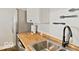 Featuring a black island and stainless steel appliances, this kitchen offers ample space for meal preparation and entertaining at 921 S State Ave, Indianapolis, IN 46203