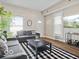 Bright and airy living room showcasing comfortable seating, contemporary decor, and natural light at 921 S State Ave, Indianapolis, IN 46203