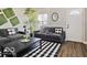 Well-decorated living room featuring stylish furniture, decorative accents, and a bright ambiance at 921 S State Ave, Indianapolis, IN 46203