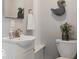 Cozy bathroom with a stylish vanity, modern faucet, and charming duck-themed decor at 923 S State Ave, Indianapolis, IN 46203