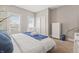Comfortable bedroom features closet, plant, changing table and two windows at 923 S State Ave, Indianapolis, IN 46203