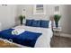 The cozy bedroom features plants, side tables, soft carpet, and natural light at 923 S State Ave, Indianapolis, IN 46203