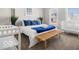 Comfortable bedroom features two windows, bench, plants, and a crib at 923 S State Ave, Indianapolis, IN 46203