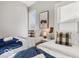 Stylishly decorated bedroom features two twin beds with soft carpet and lots of natural light at 923 S State Ave, Indianapolis, IN 46203