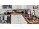 Bright kitchen features stainless steel appliances, butcher block countertops, and ample cabinet space at 923 S State Ave, Indianapolis, IN 46203
