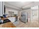 Spacious kitchen with white cabinets, stainless steel appliances, and wood countertops offers a modern and efficient cooking experience at 923 S State Ave, Indianapolis, IN 46203