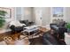 Comfortable living room featuring hardwood floors, stylish seating, and ample natural light at 923 S State Ave, Indianapolis, IN 46203