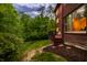 Exterior view of brick home with deck and outdoor seating at 9387 Sullivan Pl, Zionsville, IN 46077